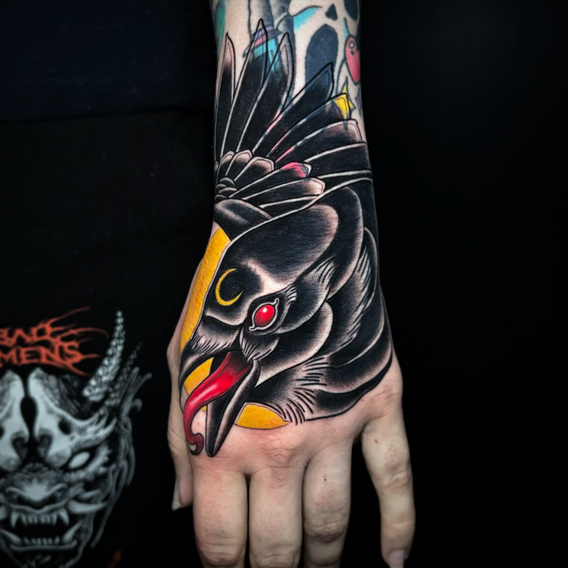 Neo traditional raven on hand tattoo by Tanner Riggs