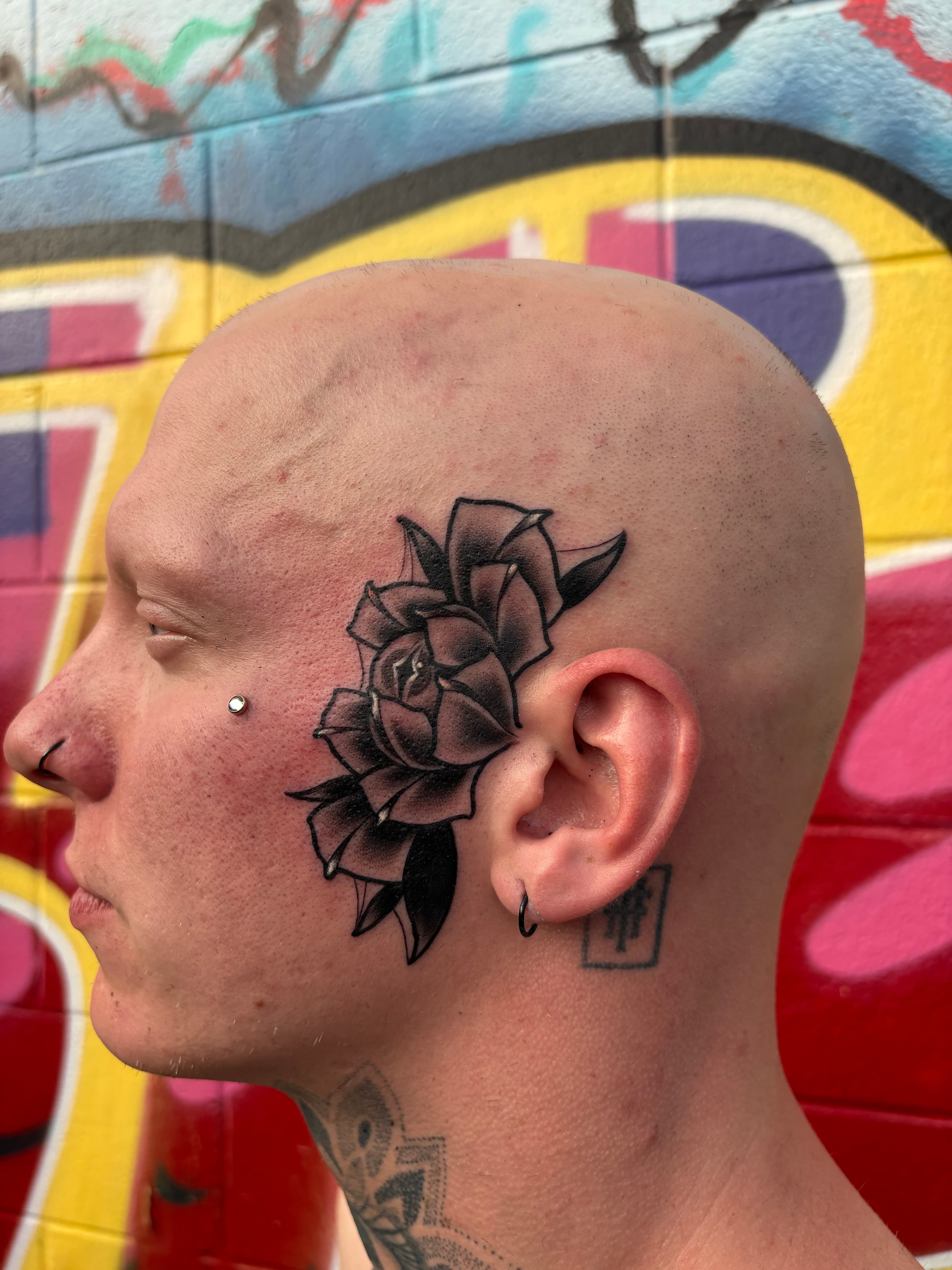 Neo traditional black and grey flower with snake eye tattoo by Tanner Riggs