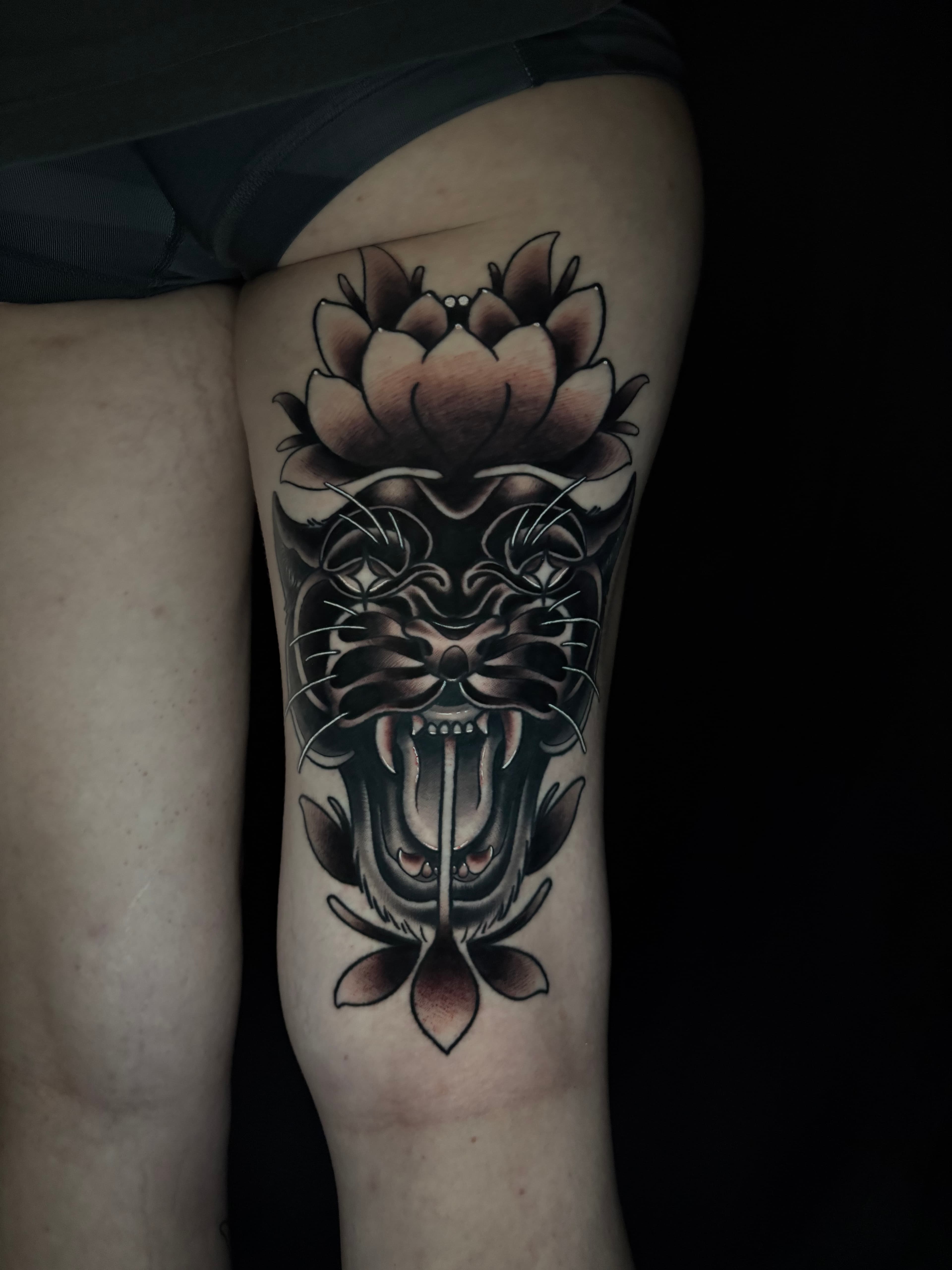 Neo traditional black and grey panther with flower tattoo by Tanner Riggs