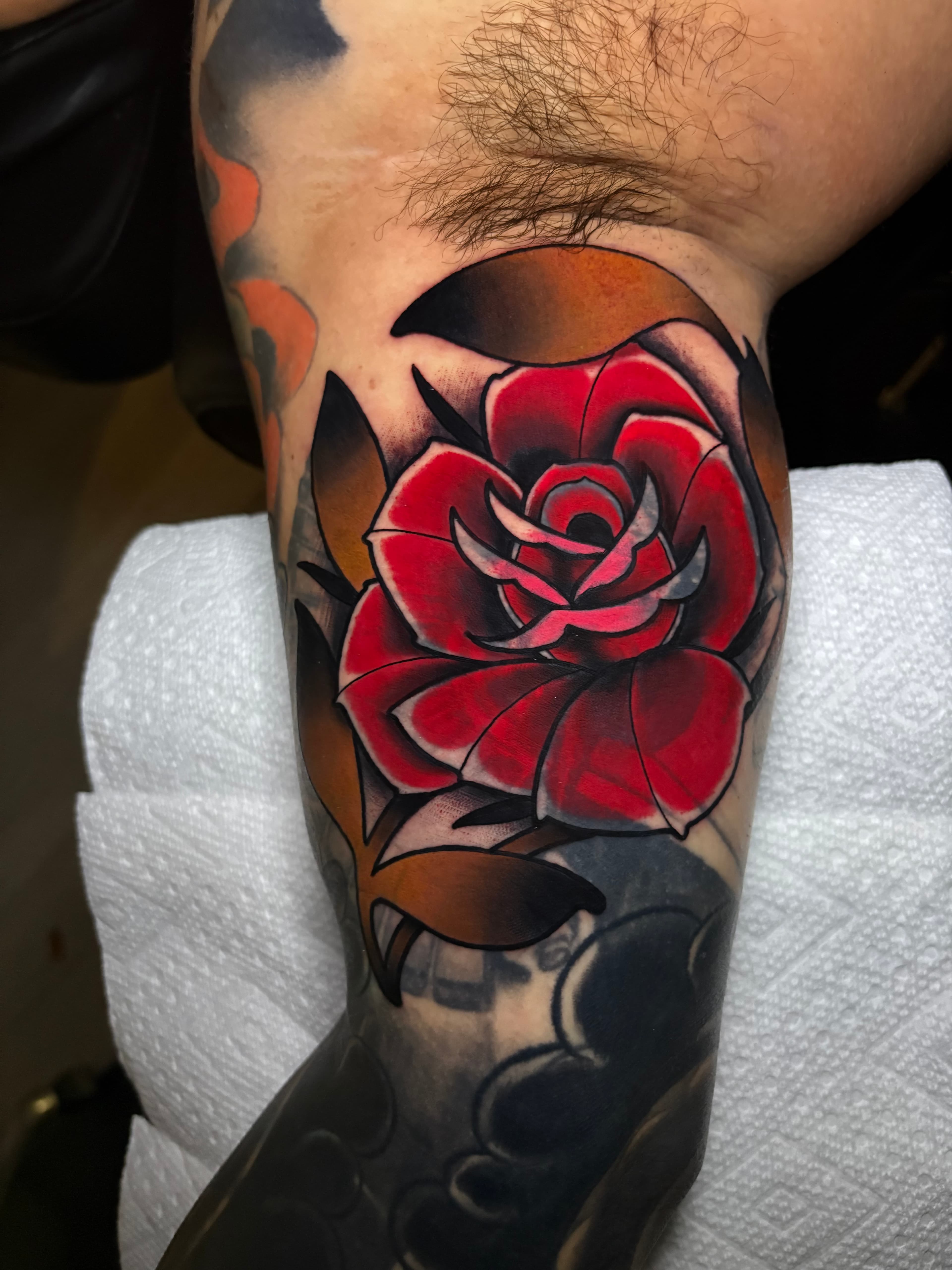 Neo traditional blast over red rose tattoo by Tanner Riggs